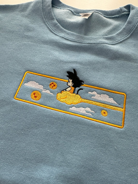 Kid Goku on Nimbus | Front Design | Embroidery Apparel